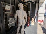 a statue of a man that is outside of a building
