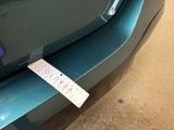 a sticker on the front bumper of a car