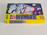the box of batman comics is sitting on a white surface