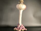 a figurine that has a crown on top of it