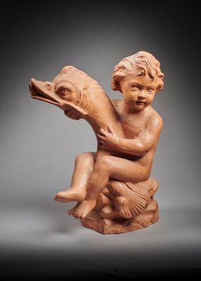 an image of a statue of a child holding a bird