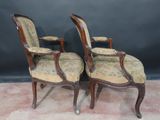 pair of antique chairs with floral upholstered upholstered seats