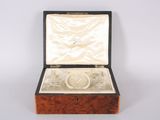 a box with a ring inside of it on a table