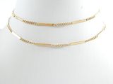 a close up of a mannequin with a gold chain on it
