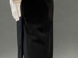 an image of a mannequin wearing a white shirt and black skirt