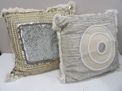 two pillows that are sitting next to each other
