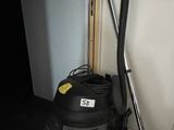 a vacuum cleaner that is sitting next to a door