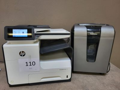 two hp printers are sitting on a table with a price tag on it