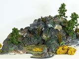 une statue représentant une montagne surmontée d'arbres