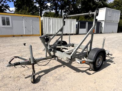 a trailer with a trailer attached to it in a parking lot