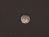 a close up of a coin on a black surface
