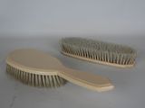 two brushes that are sitting on a table