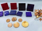 a lot of gold and silver coins on a table