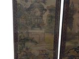 two framed paintings of a garden with a fountain and flowers