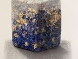 painting of a blue and white block with gold foil on it