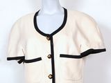 an image of a white and black jacket on a mannequin mannequin