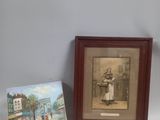 deux photos encadrées représentant une femme et un tableau représentant un homme dans la rue