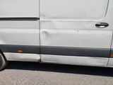 a white van parked on the side of the road