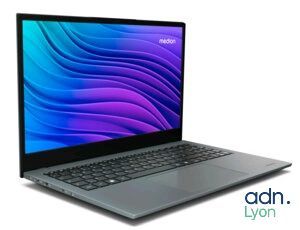 the laptop is open on a white surface with a blue background