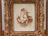 an old picture of a nude woman sitting on a chair in front of a mirror