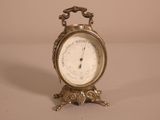 a small clock that is sitting on a table