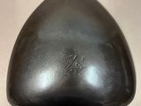 a black object that is on a white surface