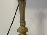 a lamp that is sitting on a table with a lamp on it