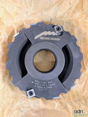 a close up of a bicycle chainring on a piece of paper