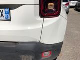 a close up of a white car with a number plate on it