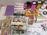 supplies laid out on a table with scissors, tape, scissors, and other crafting supplies