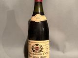 a bottle of wine that is sitting on a table