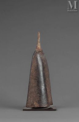 a close up of a metal object on a gray surface
