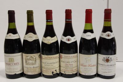 six bottles of wine are lined up in a row on a table