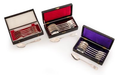 three silver plated spoons and forks in a black case