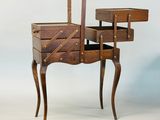 an old wooden table with drawers and a drawer on it