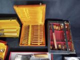 many different types of knives and knives in a box