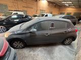 many cars parked in a parking lot in a garage
