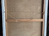 an old wooden easel with a piece of burlock on top of it