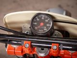 a close up of a motorcycle with a speedometer on it ' s handlebars