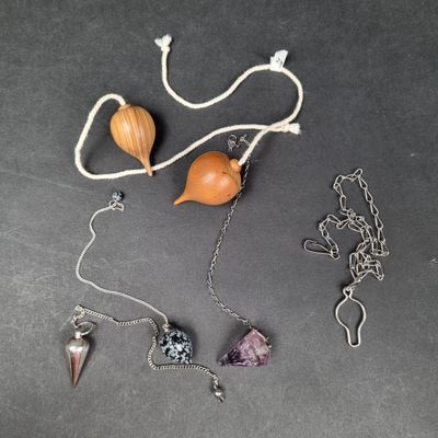 a picture of a necklace with various items on it