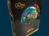 a box that has a model of a globe in it