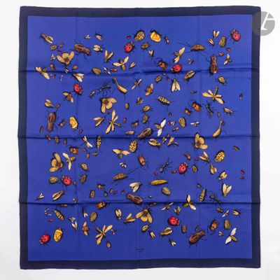 a blue square scarf with insects and ladybugs on it
