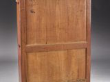 an old wooden cabinet with a drawer on top of it