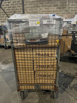 a cart that has a bunch of boxes on top of it