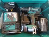 two makitas in a green box with two batteries in it