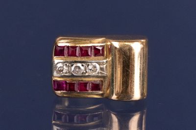 an image of a red and white diamond ring on a blue surface