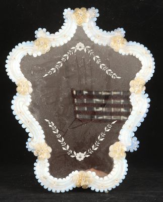 a picture of a star shaped mirror on a table