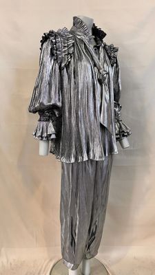 an image of a mannequin dressed in silver with ruffles on it