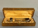 a box with two spoons and a spoon in it