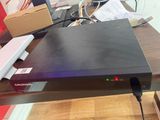 a black box sitting on top of a wooden table